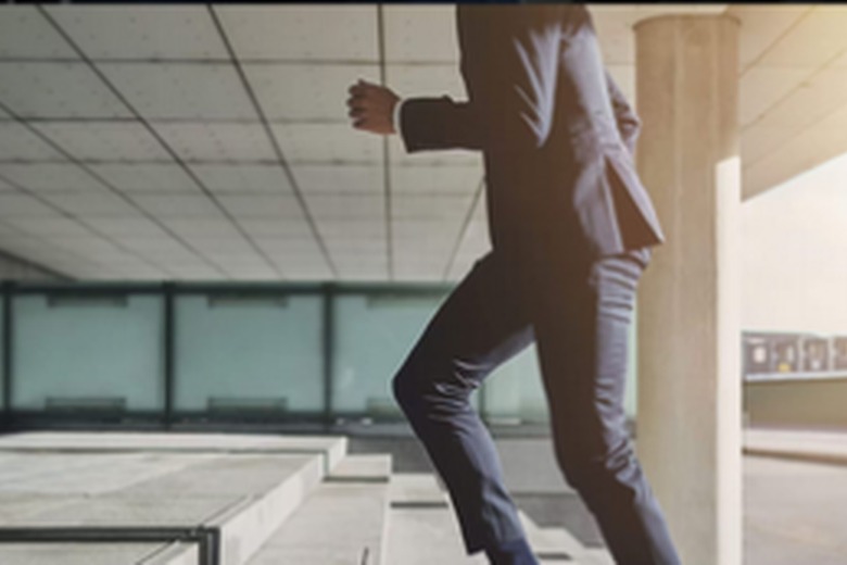 Professional walking in modern office